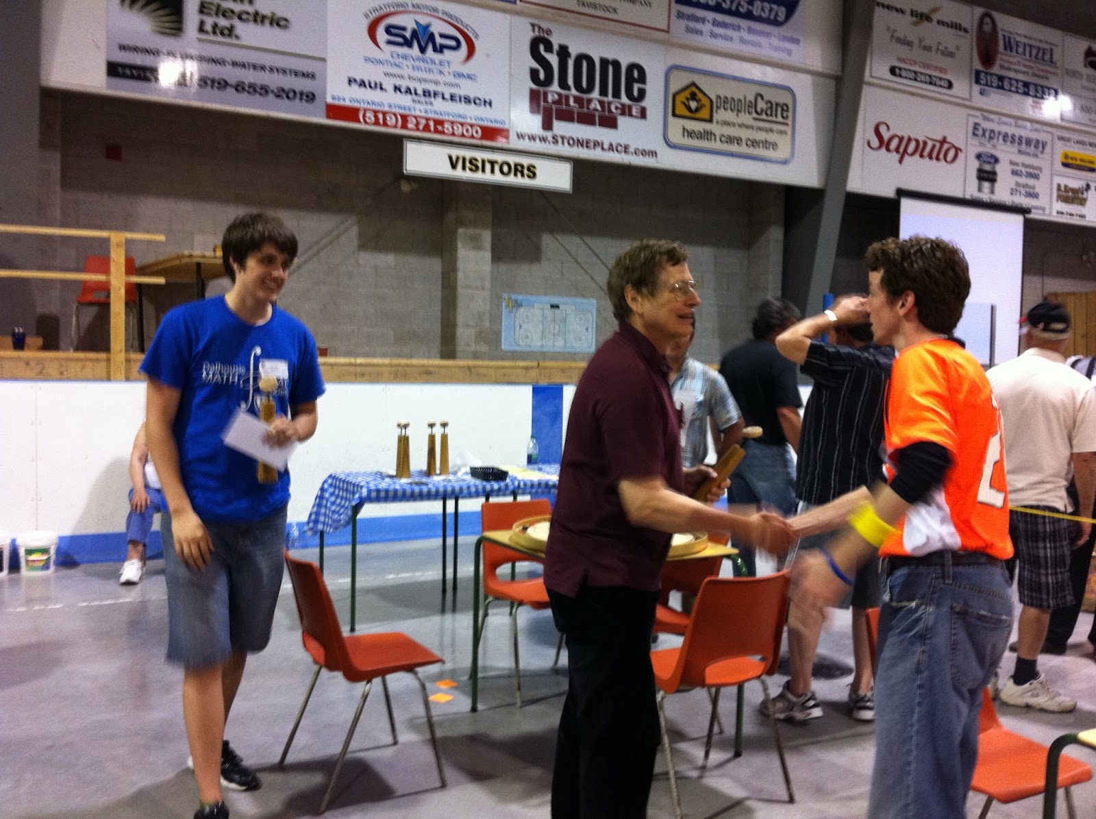 Justin (left) and Fred Slater (middle) being congratulated by Matt Brown (right) after being crown 2013 World Doubles Champions