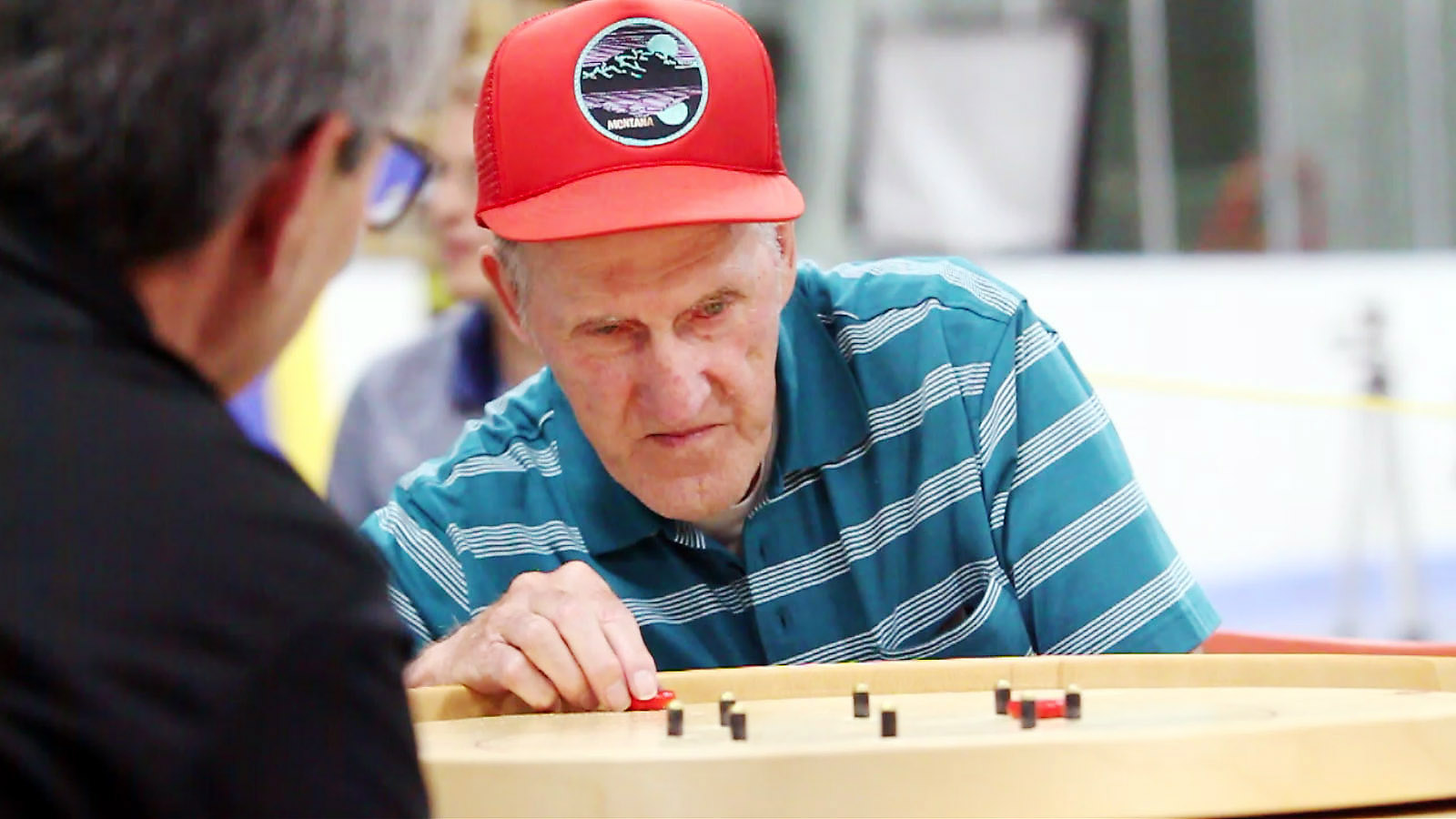 Robert Bonnett takes a shot during the final match on his way to the 2017 World Crokinole Championship. Photo Credit: Bill Gladding